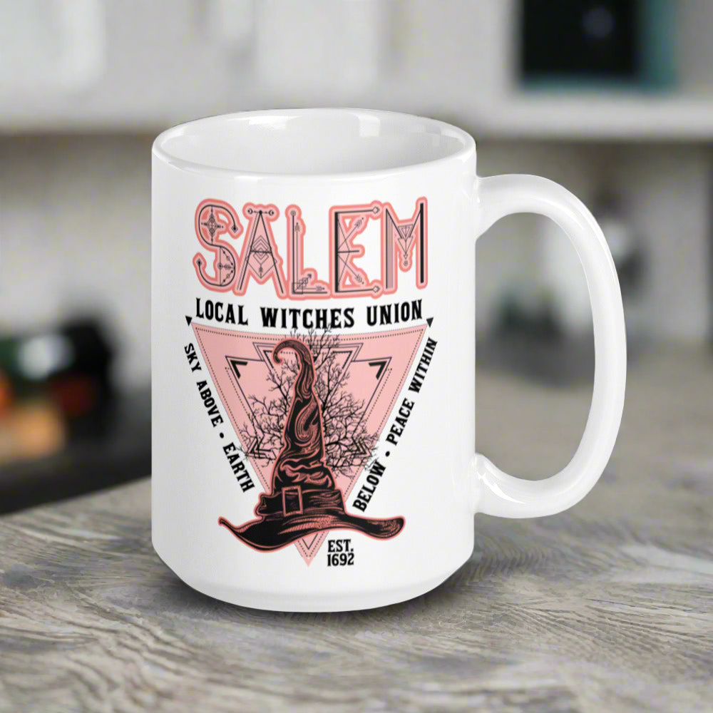 This ceramic glossy mug says Salem Local Witches Union and features a pointy pink and black witch's hat. It says Sky Above Earth Below Peace Within Est 1692.This ceramic glossy mug says Salem Local Witches Union and features a pointy pink and black witch's hat. It says Sky Above Earth Below Peace Within Est 1692.