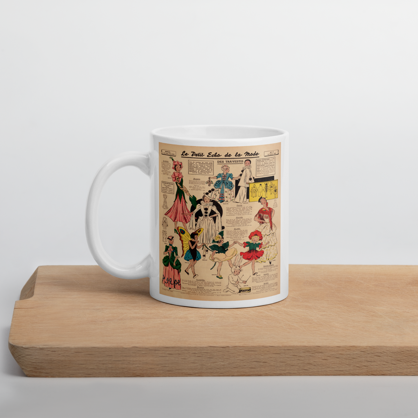 This ceramic glossy coffee mug features a page from a French Magazine from 1938 featuring Halloween Costume patterns.