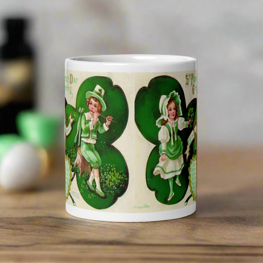 This glossy coffee mug features a retro illustration that says St. Patrick's Day Erin Go Bragh, alongside a festive Irish blessing:
"Gather ya Shamrock while ye may, Go to the tune of the lute on St. Patrick’s Day."