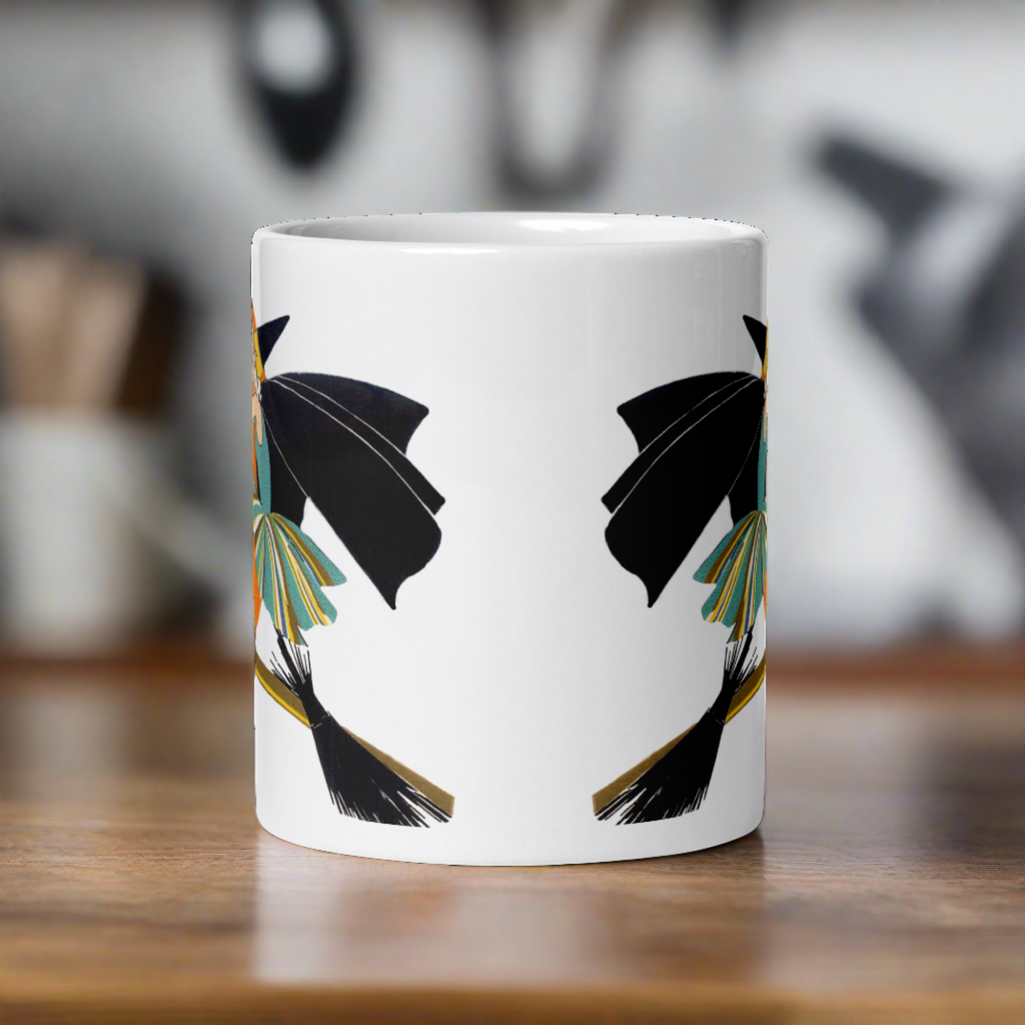 This ceramic coffee mug features a vintage deco illustration of a cute flapper witch flying on a broom with an orange full moon behind her. 