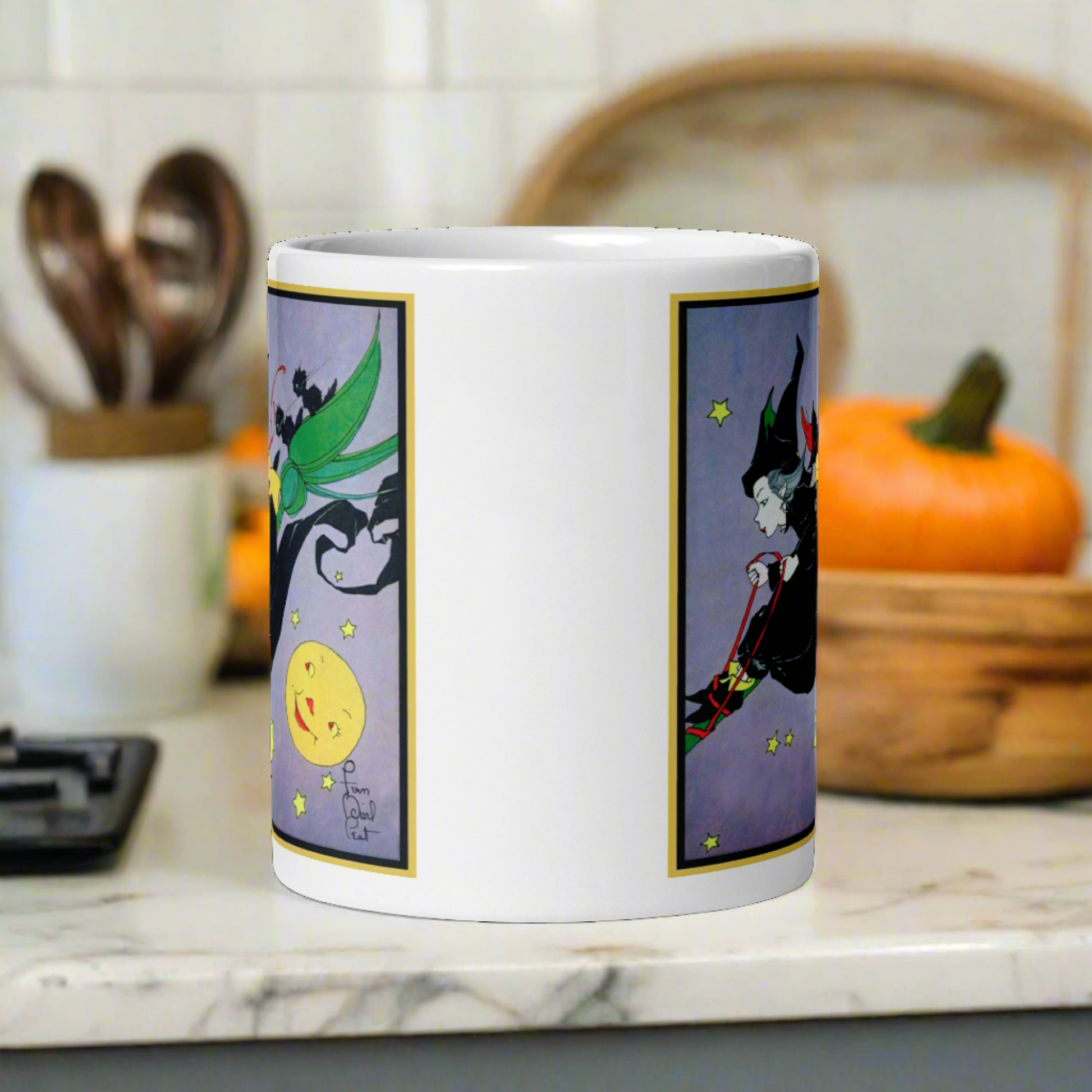 This ceramic glossy mug features a vintage Halloween illustration by Fern Bisel Peat. It features a witch dressed in all black soaring through the air on her broom with black cats. There is a smiling full yellow moon.