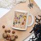 This ceramic glossy coffee mug features a page from a French Magazine from 1938 featuring Halloween Costume patterns.