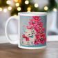 This glossy ceramic coffee cup features an adorable vintage retro print of a white christmas kitten with a blue ornament in her mouth. She is wearing a pink bow and is sitting next to a pink Christmas tree with a blue background.