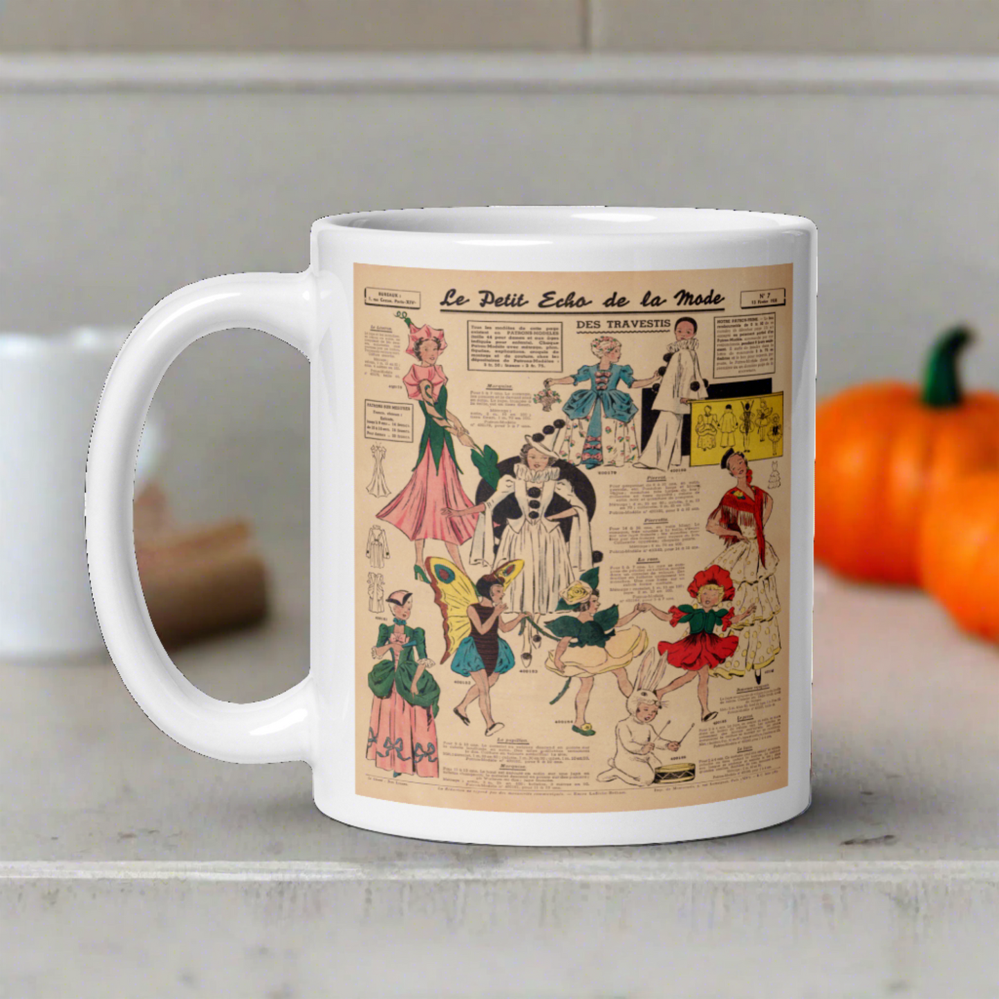 This ceramic glossy coffee mug features a page from a French Magazine from 1938 featuring Halloween Costume patterns.