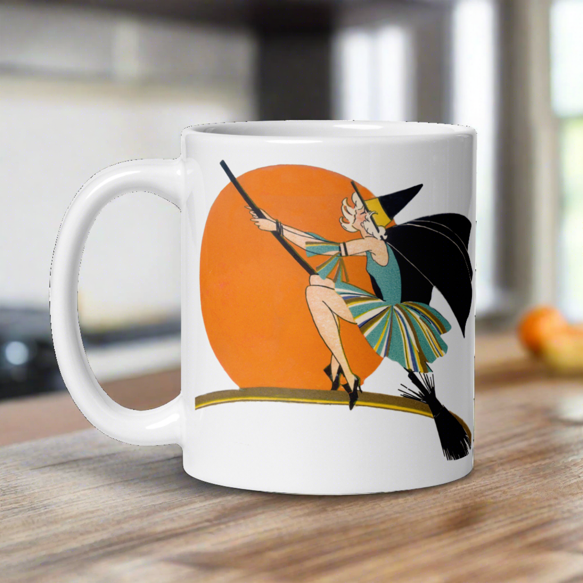 This ceramic coffee mug features a vintage deco illustration of a cute flapper witch flying on a broom with an orange full moon behind her. 