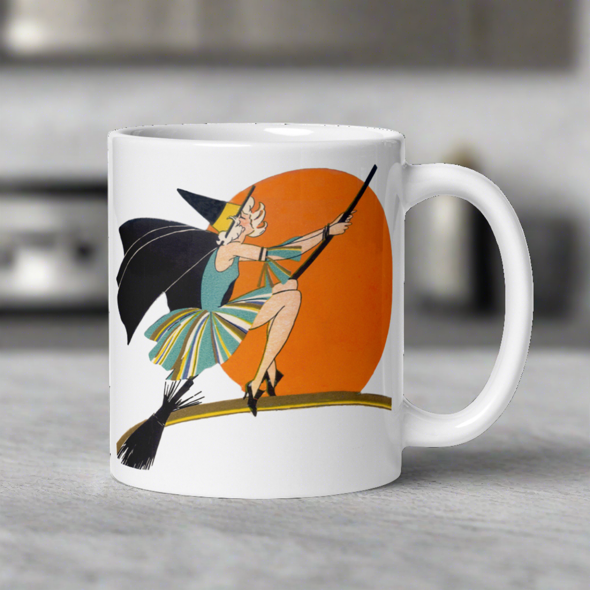 This ceramic coffee mug features a vintage deco illustration of a cute flapper witch flying on a broom with an orange full moon behind her. 