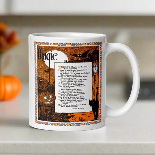 This glossy ceramic coffee mug features a vintage Halloween print of a poem titled Magic by John Martin. The illustration features a full moon, jack o'lantern, black cat, owls, bats and a clock.