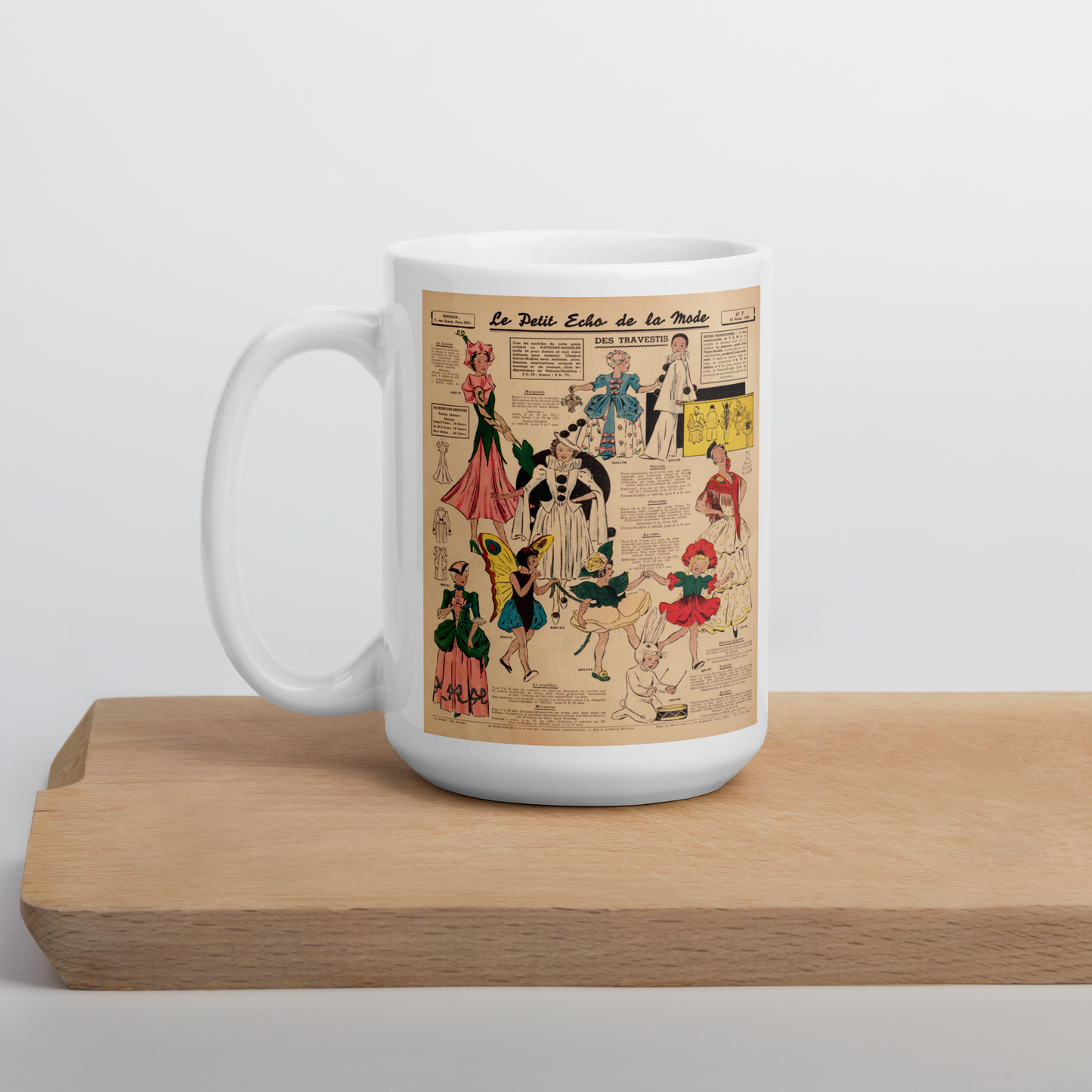 This ceramic glossy coffee mug features a page from a French Magazine from 1938 featuring Halloween Costume patterns.