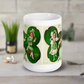 This glossy coffee mug features a retro illustration that says St. Patrick's Day Erin Go Bragh, alongside a festive Irish blessing:
"Gather ya Shamrock while ye may, Go to the tune of the lute on St. Patrick’s Day."