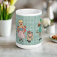 This ceramic glossy coffee mug features characters from the Lonely Goatherd scene in The Sound of Music with a plaid green background.