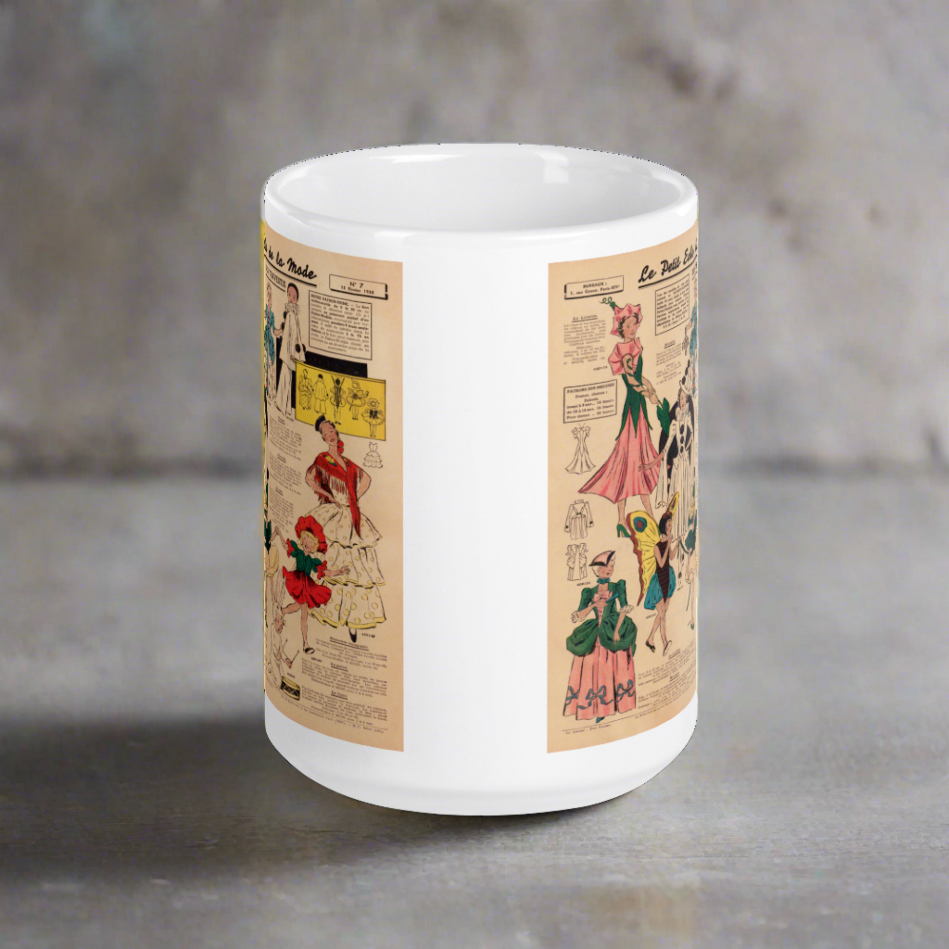 This ceramic glossy coffee mug features a page from a French Magazine from 1938 featuring Halloween Costume patterns.