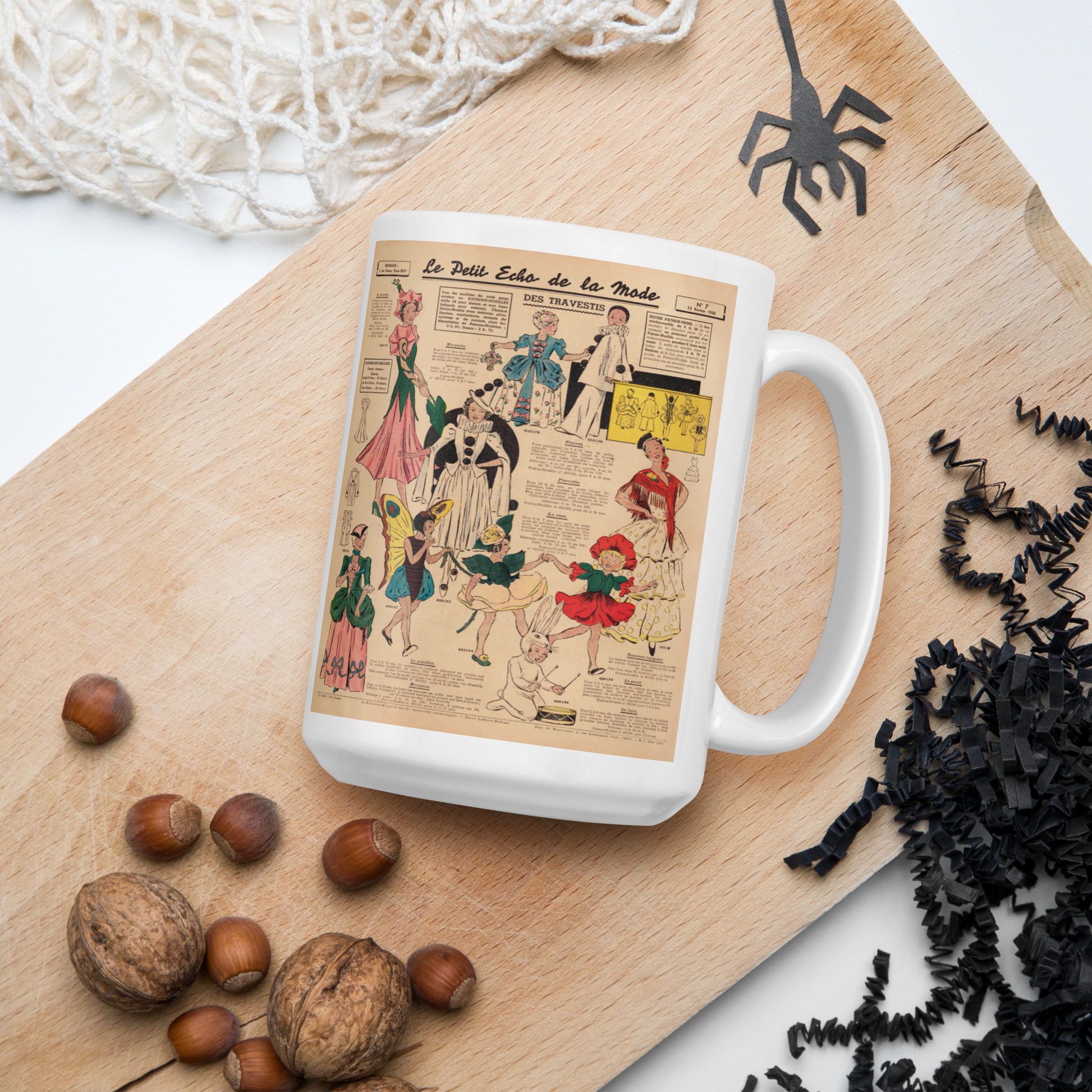 This ceramic glossy coffee mug features a page from a French Magazine from 1938 featuring Halloween Costume patterns.