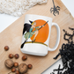 This ceramic coffee mug features a vintage deco illustration of a cute flapper witch flying on a broom with an orange full moon behind her. 