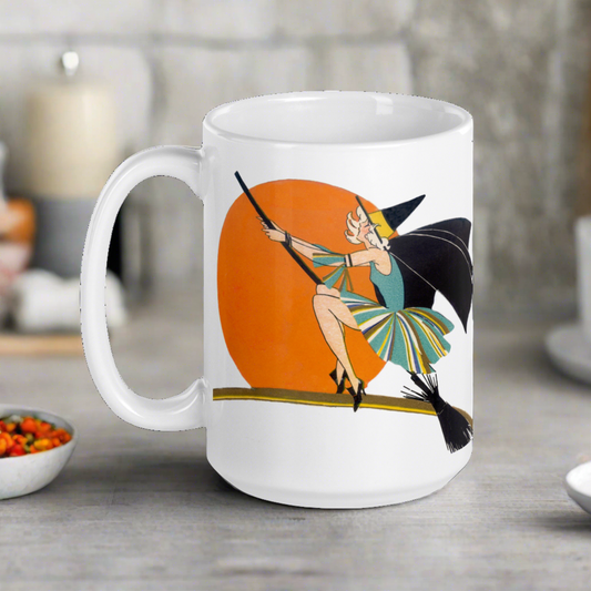 This ceramic coffee mug features a vintage deco illustration of a cute flapper witch flying on a broom with an orange full moon behind her. 