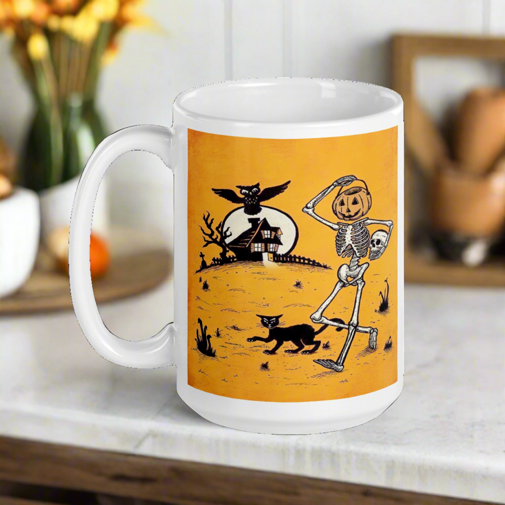 This ceramic glossy coffee mug features a vintage Halloween illustration of a skeleton with a jack o lantern for a head, a black cat, a black owl, a spooky house and a full moon. 