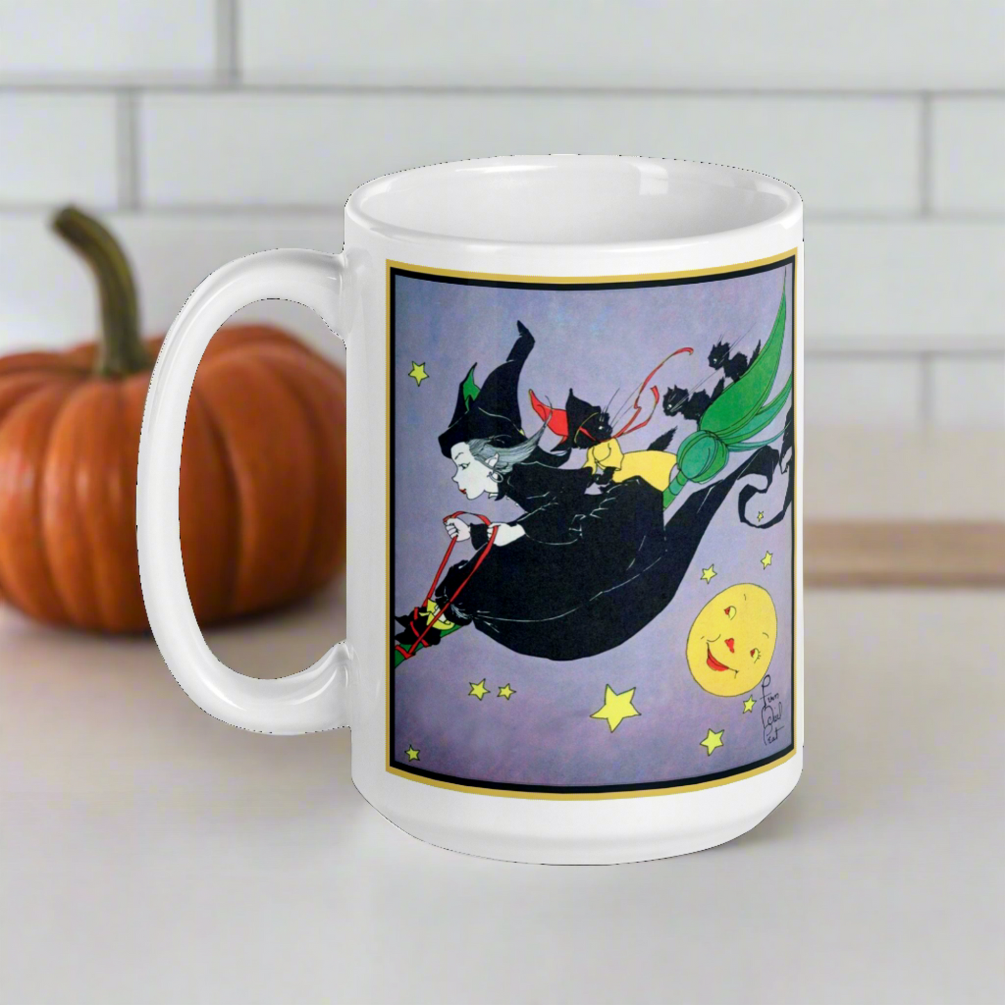 This ceramic glossy mug features a vintage Halloween illustration by Fern Bisel Peat. It features a witch dressed in all black soaring through the air on her broom with black cats. There is a smiling full yellow moon.