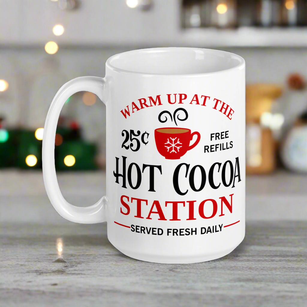 This ceramic glossy coffee mug says Warm Up At The Hot Cocoa Station Served Fresh Daily.It features a cute little red cup with a snowflake on it.