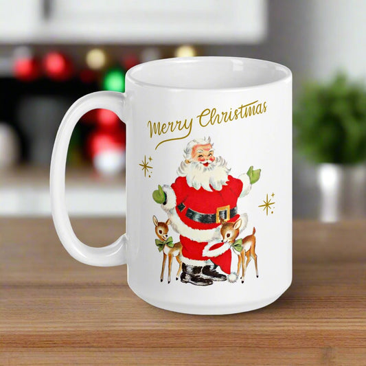 This ceramic glossy coffee mug features Midcentury retro Christmas artwork of a winking Santa wearing green gloves with two baby reindeer. The reindeer are wearing green bows and one is holding Santa's hat in her mouth. There are gold stars and lettering that says Merry Christmas.