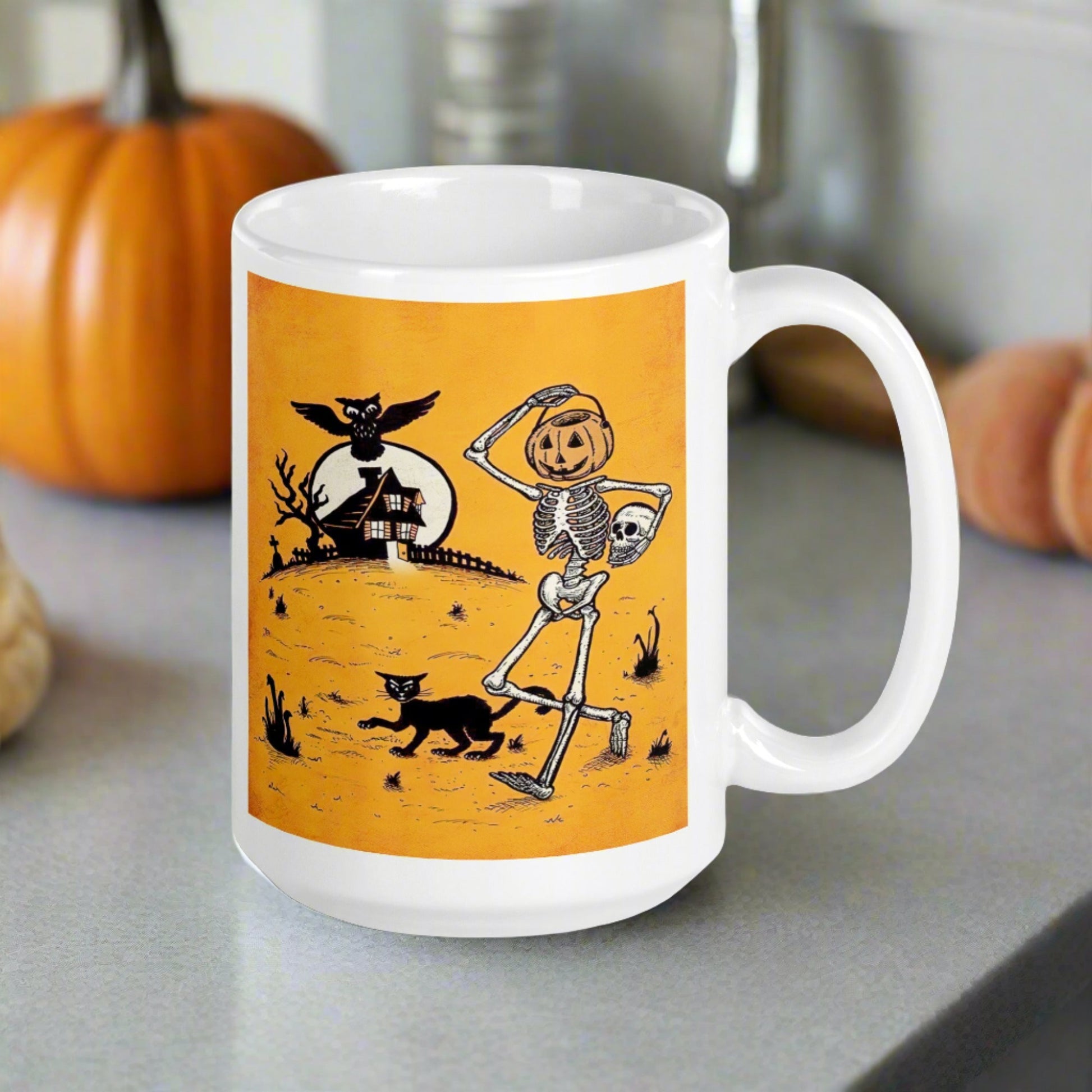 This ceramic glossy coffee mug features a vintage Halloween illustration of a skeleton with a jack o lantern for a head, a black cat, a black owl, a spooky house and a full moon. 