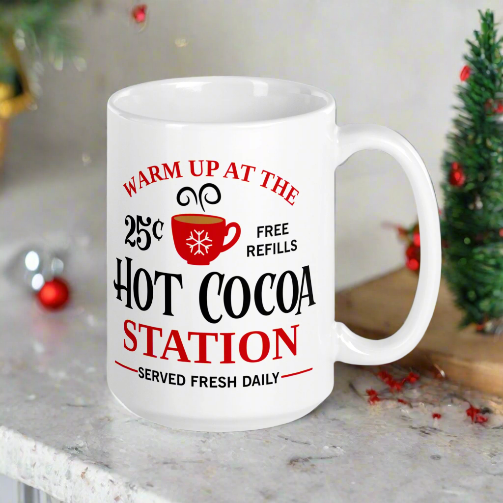 This ceramic glossy coffee mug says Warm Up At The Hot Cocoa Station Served Fresh Daily.It features a cute little red cup with a snowflake on it.