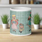 This ceramic glossy coffee mug features characters from the Lonely Goatherd scene in The Sound of Music with a plaid green background.