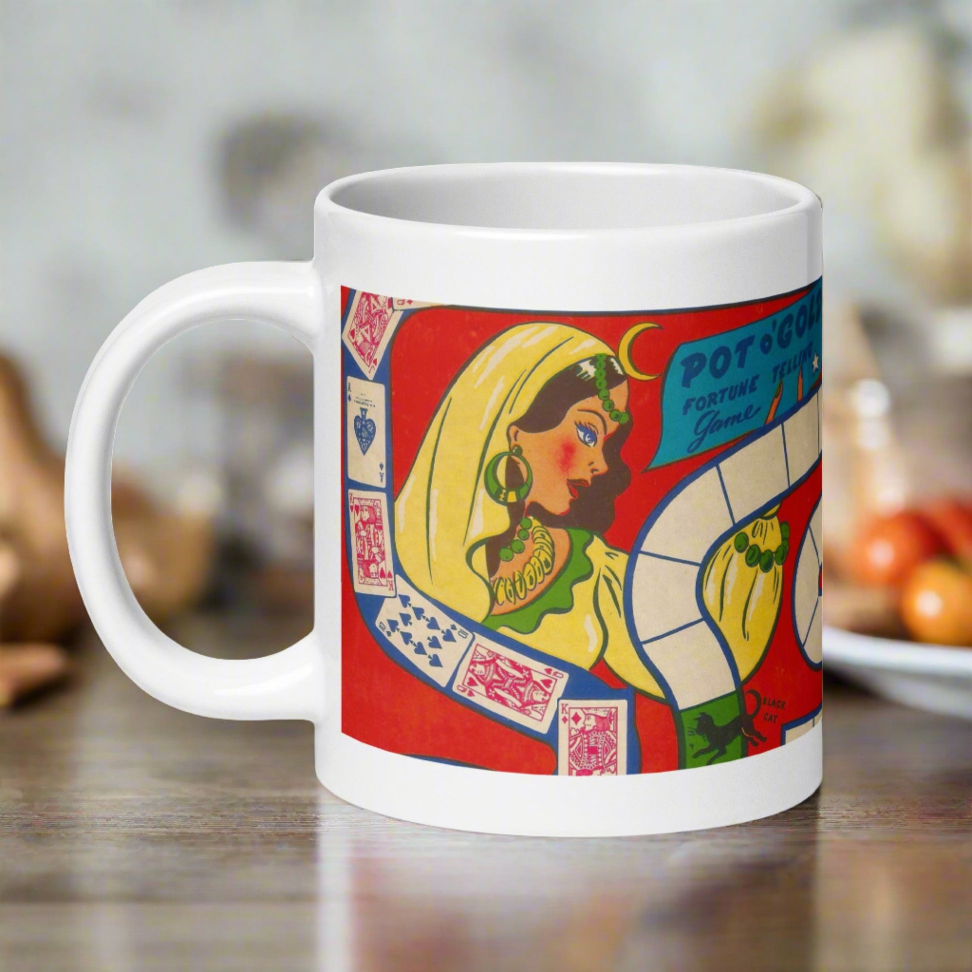This ceramic glossy coffee mug features a vintage Halloween illustration of a Pot O'Gold Fortune Telling Game. It features a celestial fortune teller dressed in yellow with cards and a board game path.